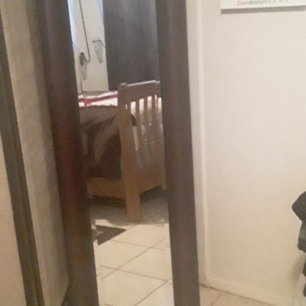 A mirror 5 feet long 1 foot wide